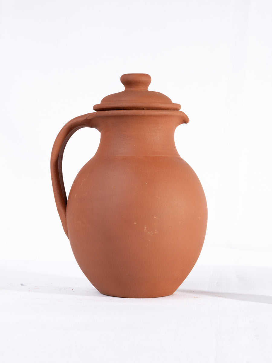 Clay water Jug with lid in matka style, handcrafted by Village Decor on white background.