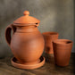 Handmade clay water Jug in traditional matka style by Village Decor, placed on a rustic wooden table.

