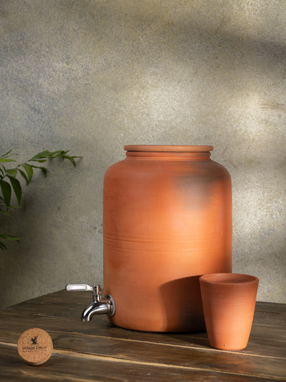 Clay water Pot with lid & Glass in matka style, handcrafted by Village Decor on white background.
