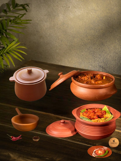 Clay cookware set with mitti ke bartan and pan placed on a wooden table, showing a homely food serving setup.