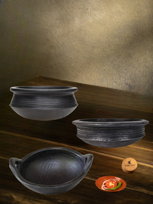 Black clay cookware combo featuring traditional handmade sets on a rustic wooden setup, perfect for authentic cooking and earthy kitchen vibes.