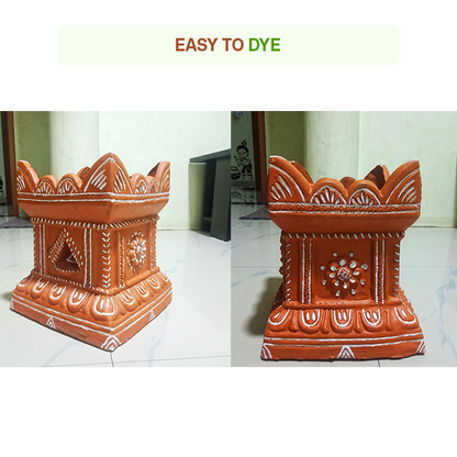 Terracotta Tulsi pots painted with white decorative patterns, showing how easily the surface can be dyed or customized for festive decor.
