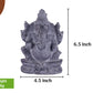 Black stone Ganesha idol with 6 inch height and 4 inch width, handcrafted sculpture for pooja and home decor use.
