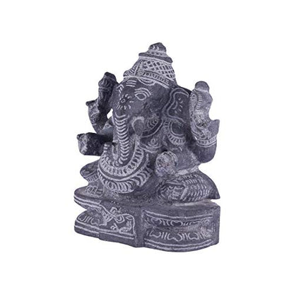 Left side view of handcrafted black stone Ganesha idol with intricate carvings for spiritual and decorative use.
