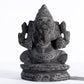 Black stone Vinayagar idol white background view handcrafted Ganesha statue for home decor vastu and spiritual placement.
