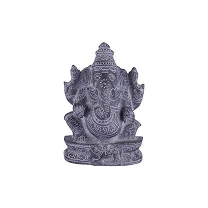 Black stone Vinayagar idol white background view handcrafted Ganesha statue for home decor vastu and spiritual placement.
