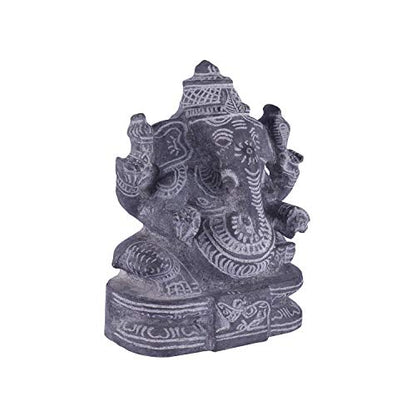 Side angle view of black stone Ganesha idol showing detailed carvings, handcrafted sculpture for pooja and decor.

